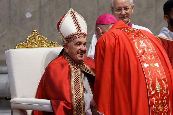 Pope Francis gives a pallium. 
