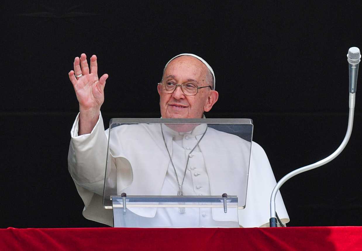 Pope Francis waves to visitors.