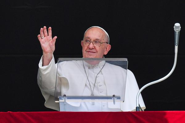 Pope Francis waves to visitors.